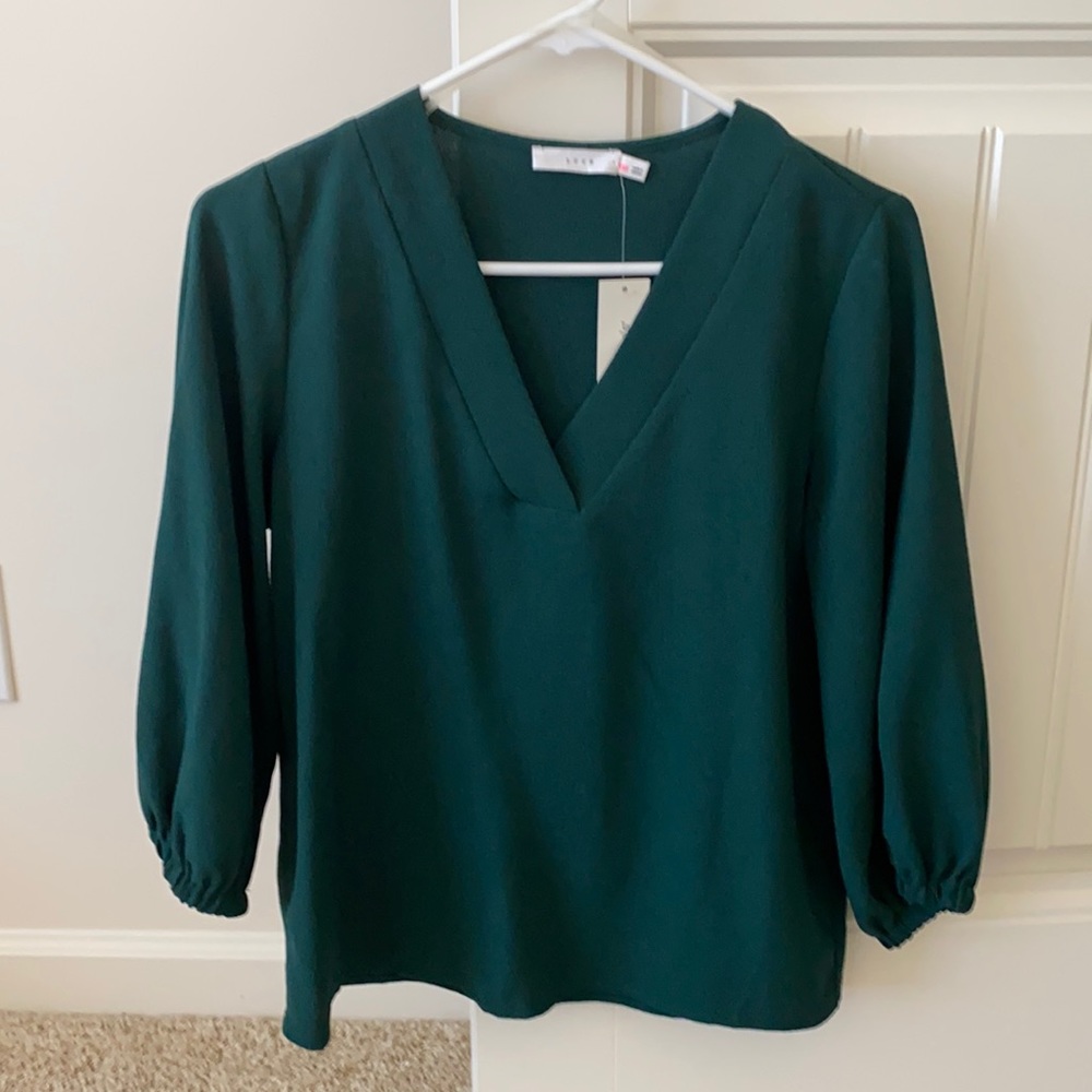 Selling this beautiful emerald green blouse!